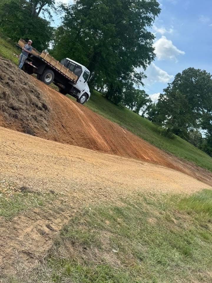 Freshly built gravel driveway through rural Mississippi countryside